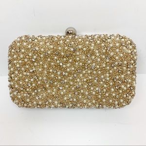 From St. Xavier Pearl Rhinestone Embellished Clutch With Silver Chain